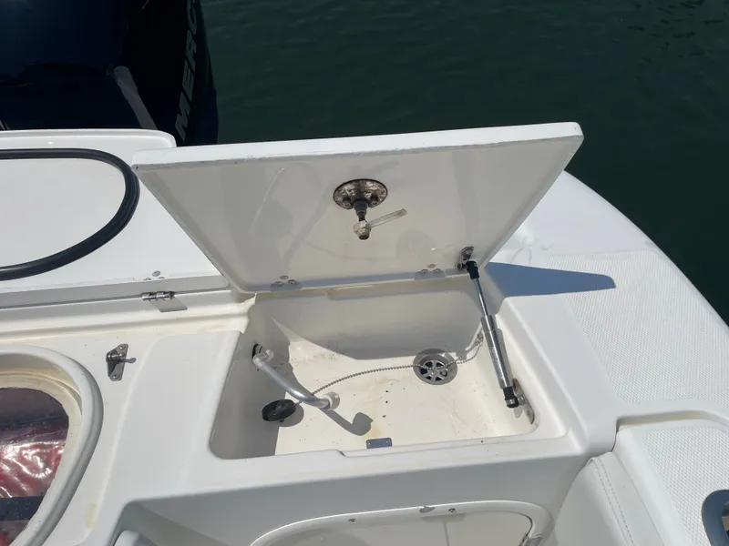 Slide: The Image of Open storage compartment on a 2006 Fountain 33 Sport Fisherman boat. - 13