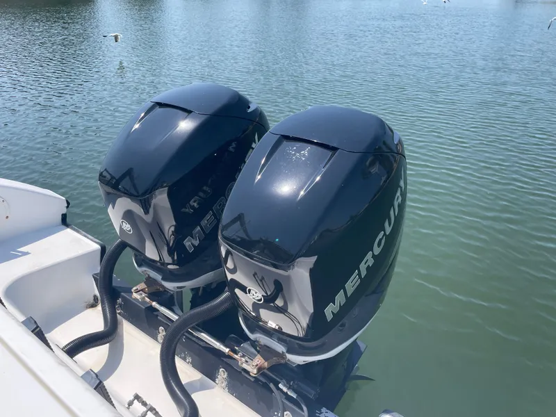 Slide: The Image of Two Mercury outboard engines on a 2006 Fountain 33 Sport Fisherman. - 19