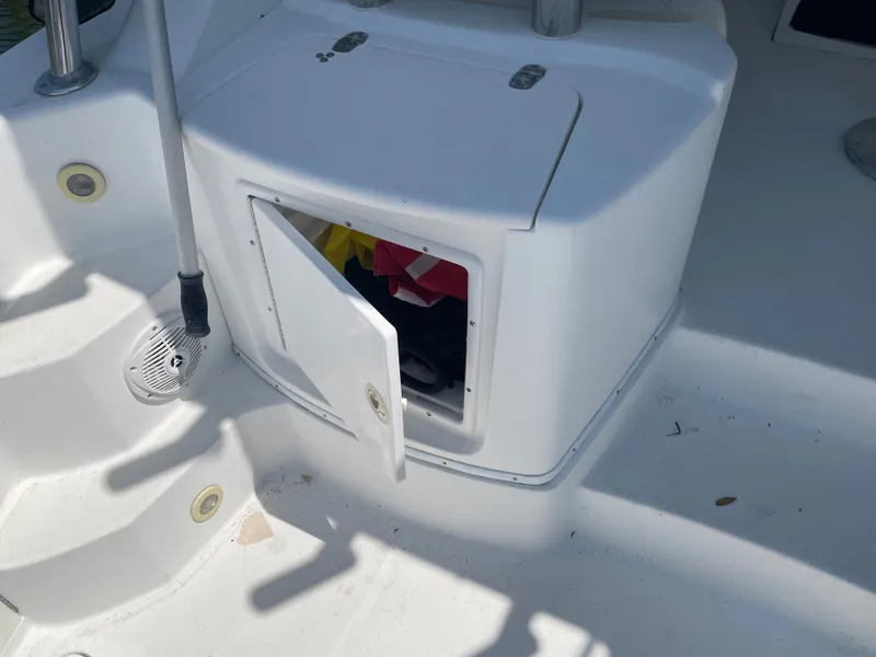 Slide: The Image of Open storage compartment on a 2006 Fountain 33 Sport Fisherman boat. - 28