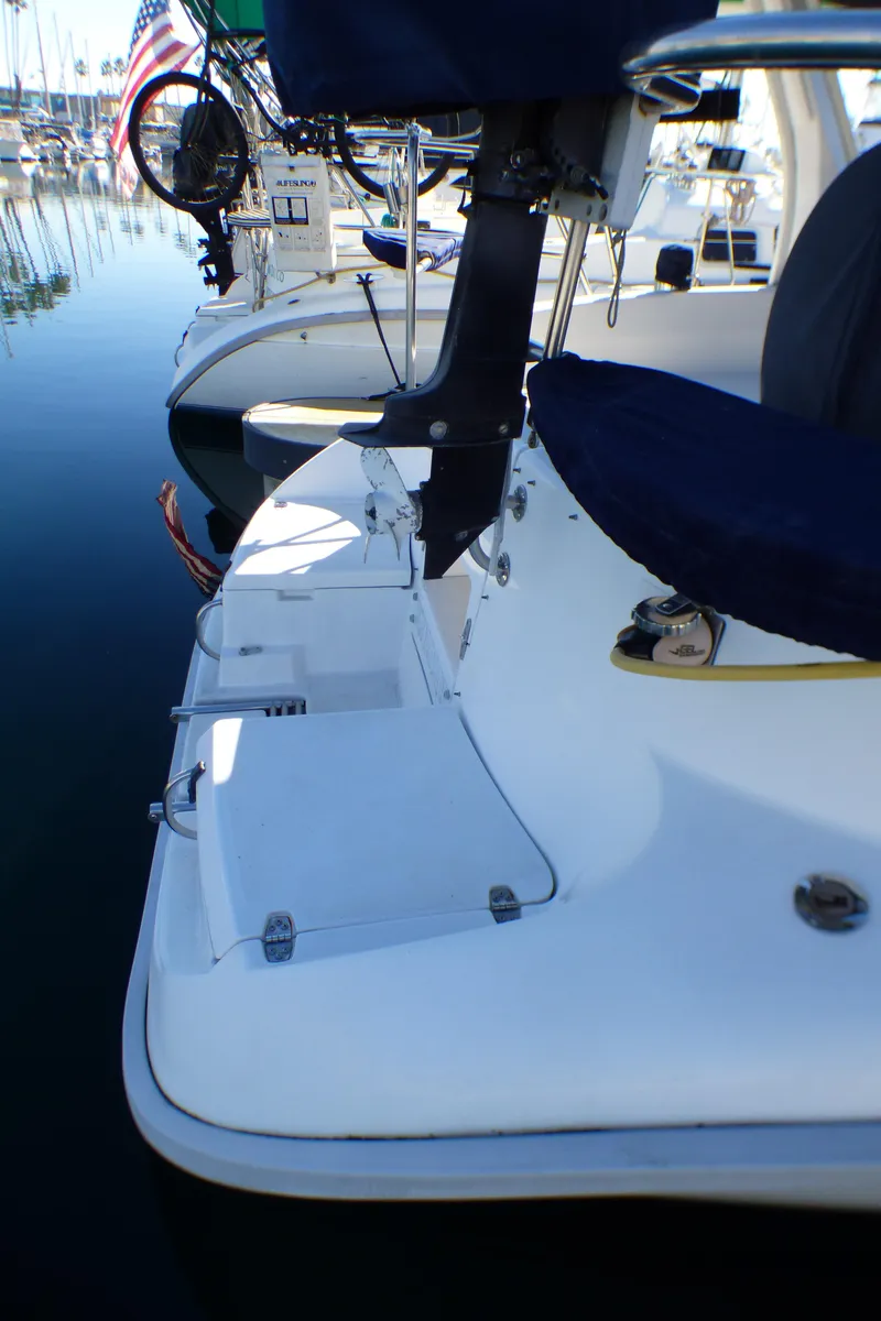 Slide: The Image of Stern of a 1998 Hunter 34 sailboat docked in marina. - 10