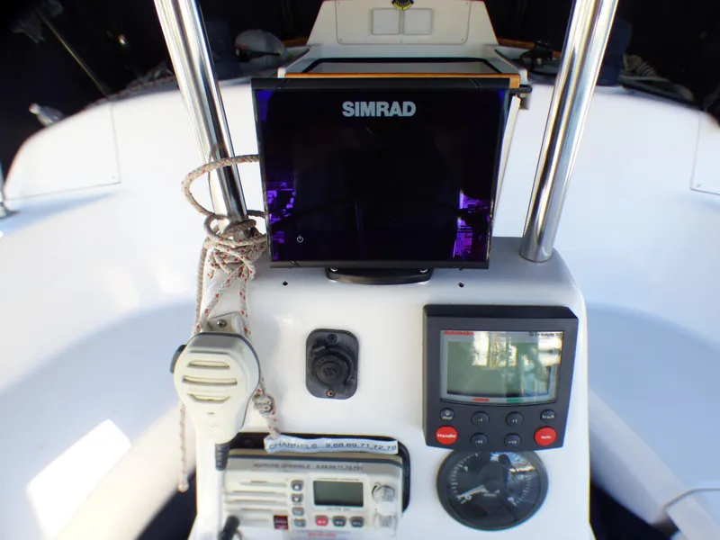 Slide: The Image of 1998 Hunter 34 sailboat cockpit with Simrad electronics. - 13