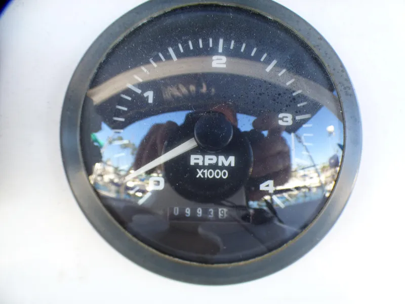 Slide: The Image of 1998 Hunter 34 tachometer displaying 9939 RPM. - 14