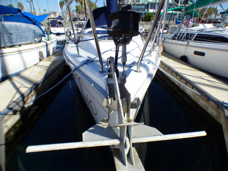 Slide: The Image of 1998 Hunter 34 sailboat docked in marina. - 2