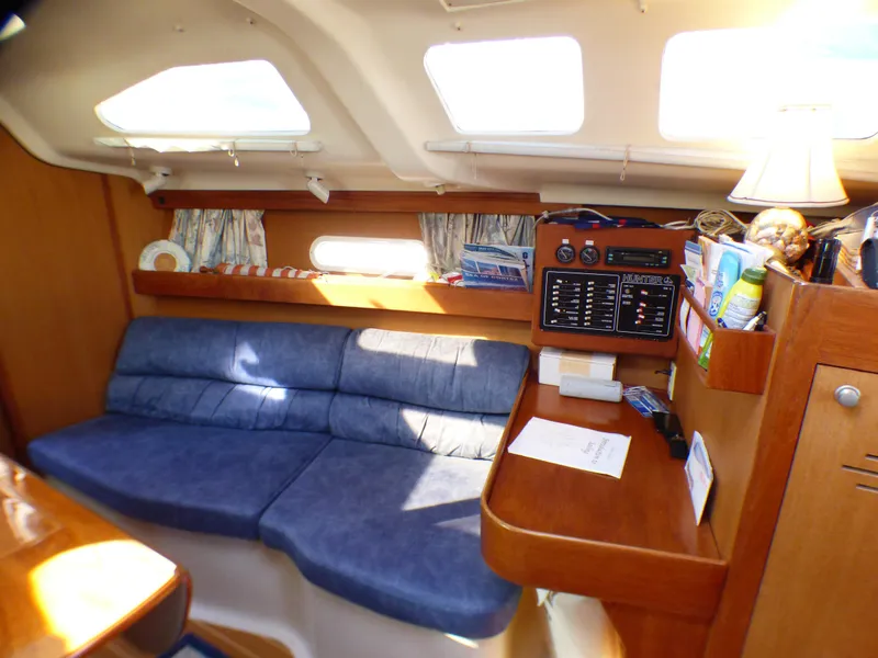 Slide: The Image of Interior of a 1998 Hunter 34 yacht with blue upholstery. - 22