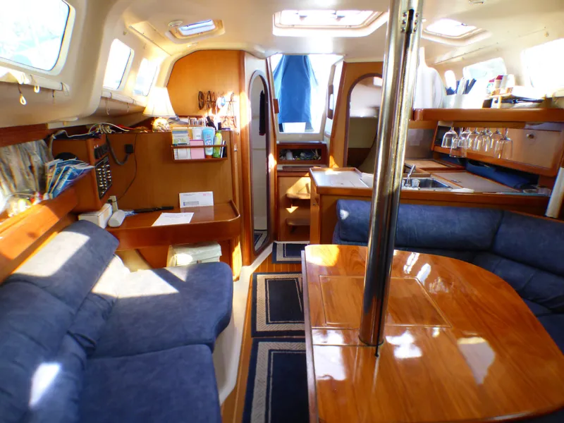 Slide: The Image of Interior of a 1998 Hunter 34 yacht with cozy furnishings. - 24