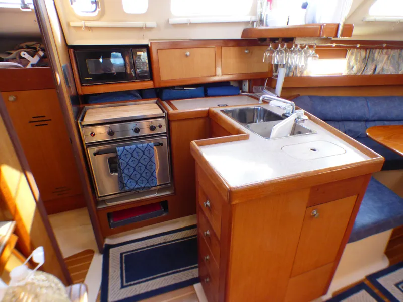 Slide: The Image of Interior of a 1998 Hunter 34 yacht with kitchen. - 25