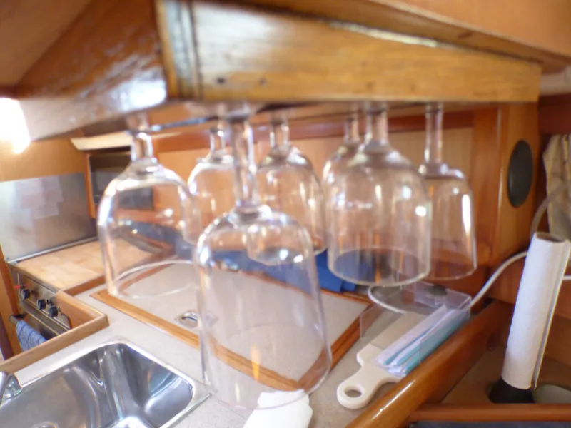 Slide: The Image of Wine glasses hanging in the galley of a 1998 Hunter 34 yacht. - 27