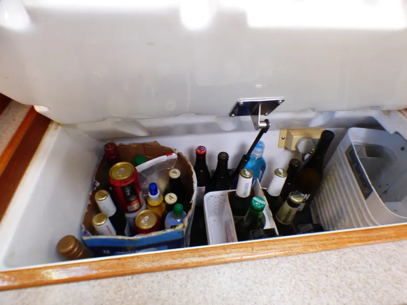 Slide: The Image of Beverage cooler in Hunter 34 boat, filled with bottles and cans. - 30
