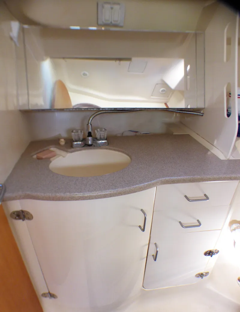 Slide: The Image of Interior of a 1998 Hunter 34 boat with sink and storage. - 37