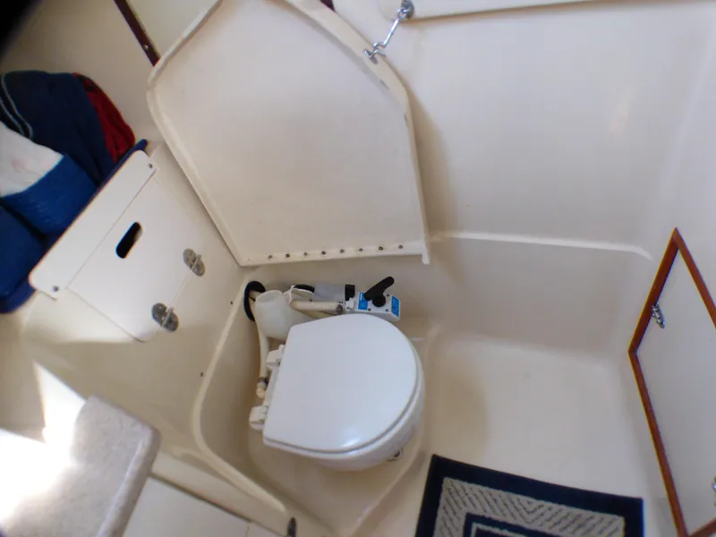 Slide: The Image of Interior of a 1998 Hunter 34 yacht, bathroom with toilet. - 38