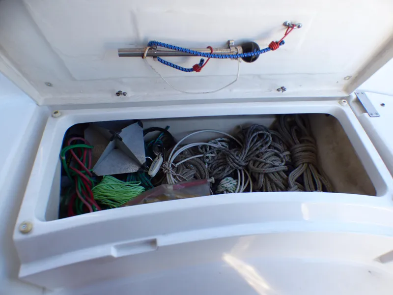Slide: The Image of Storage compartment of a 1998 Hunter 34 sailboat with ropes and anchor. - 43