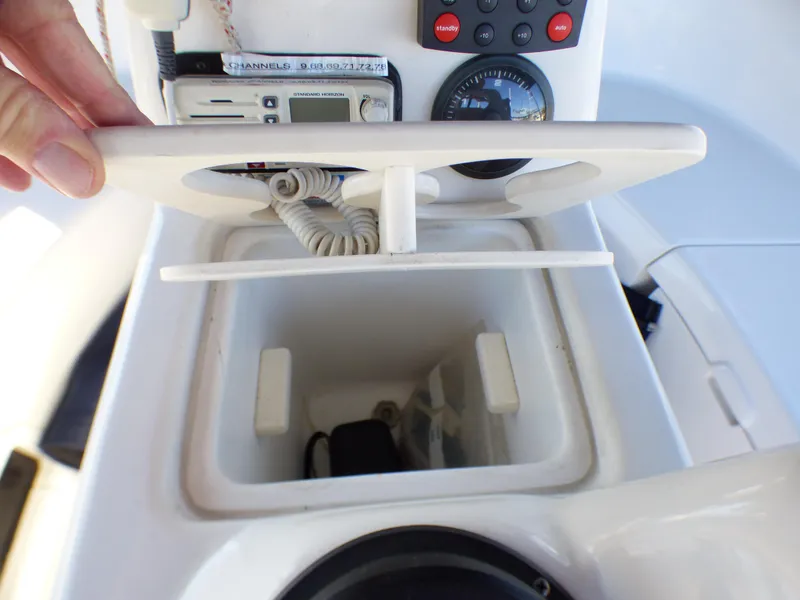 Slide: The Image of Interior view of a 1998 Hunter 34 boat console compartment. - 44