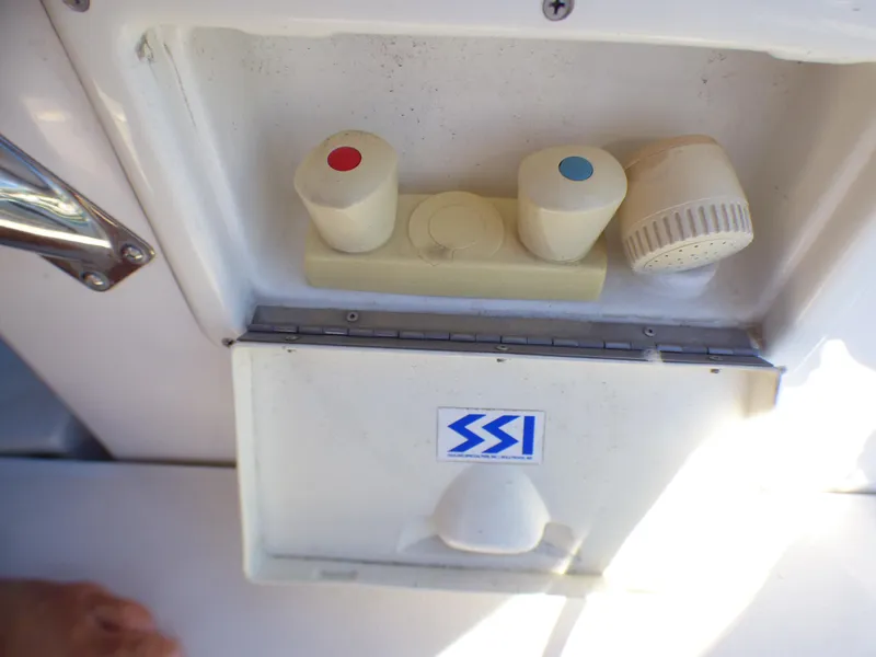 Slide: The Image of Hunter 34 boat controls with SSI logo, year 1998. - 47