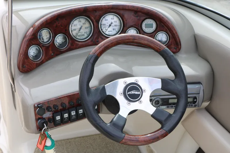 Slide: The Image of Steering wheel and dashboard of 2006 Caravelle 207 Bow Rider boat. - 22