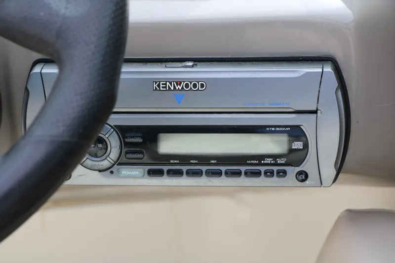 Slide: The Image of Kenwood stereo system in 2006 Caravelle 207 Bow Rider boat dashboard. - 23