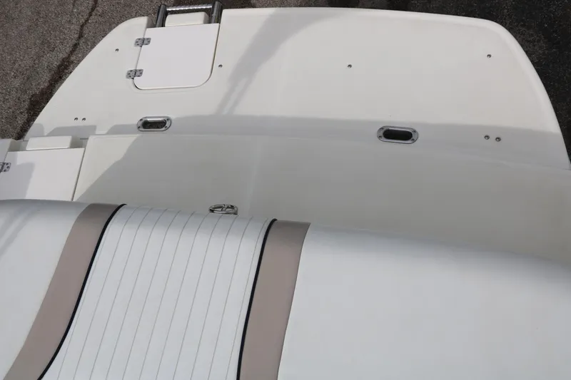 Slide: The Image of Rear view of a 2006 Caravelle 207 Bow Rider boat deck and seating area. - 28