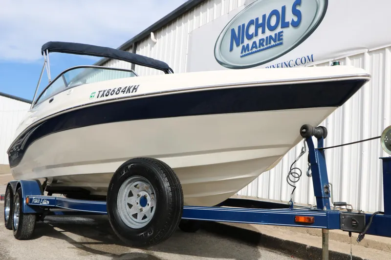 Slide: The Image of 2006 Caravelle 207 Bow Rider boat on trailer at Nichols Marine dealership. - 3