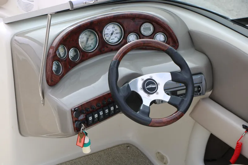 Slide: The Image of Steering wheel and dashboard of 2006 Caravelle 207 Bow Rider boat. - 31