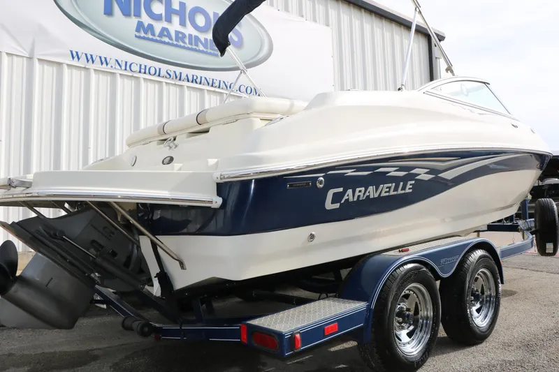 Slide: The Image of 2006 Caravelle 207 Bow Rider boat on trailer at Nichols Marine dealership. - 7