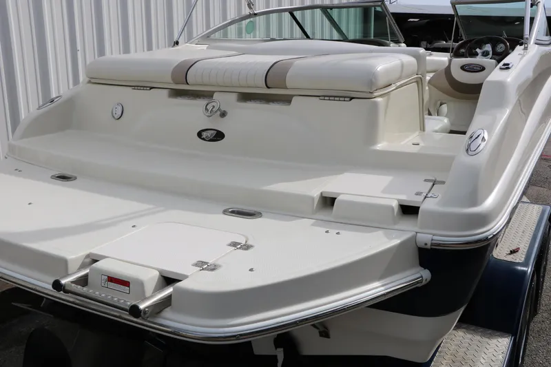 Slide: The Image of 2006 Caravelle 207 Bow Rider boat with spacious seating and sleek design. - 9