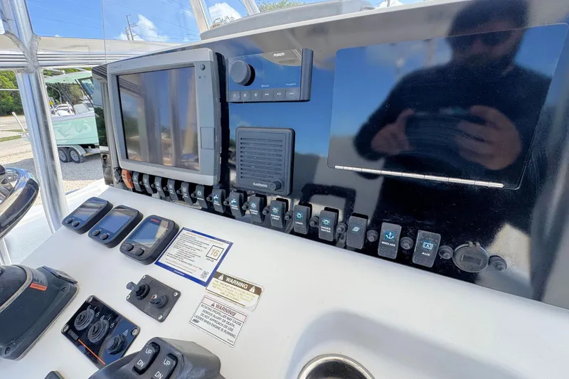 Slide: The Image of Control panel of a 2011 Sea Hunt Gamefish 25 boat with electronic displays. - 10
