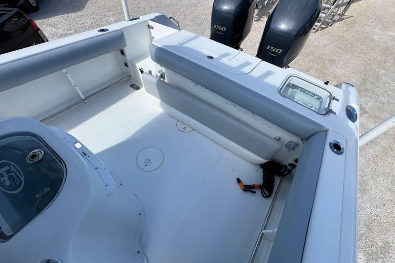 Slide: The Image of 2011 Sea Hunt Gamefish 25 boat interior with dual Yamaha 150 engines. - 5