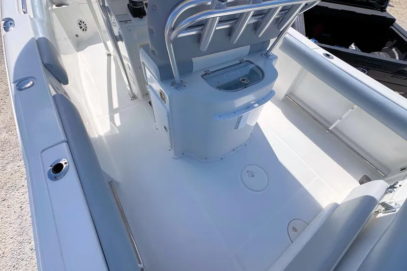 Slide: The Image of 2011 Sea Hunt Gamefish 25 boat interior, featuring clean deck and seating area. - 6
