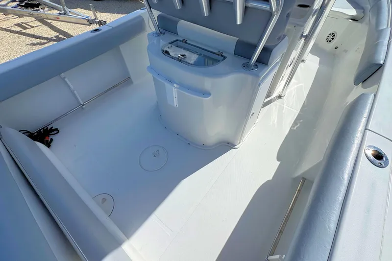 Slide: The Image of 2011 Sea Hunt Gamefish 25 boat interior with seating and storage compartments. - 7