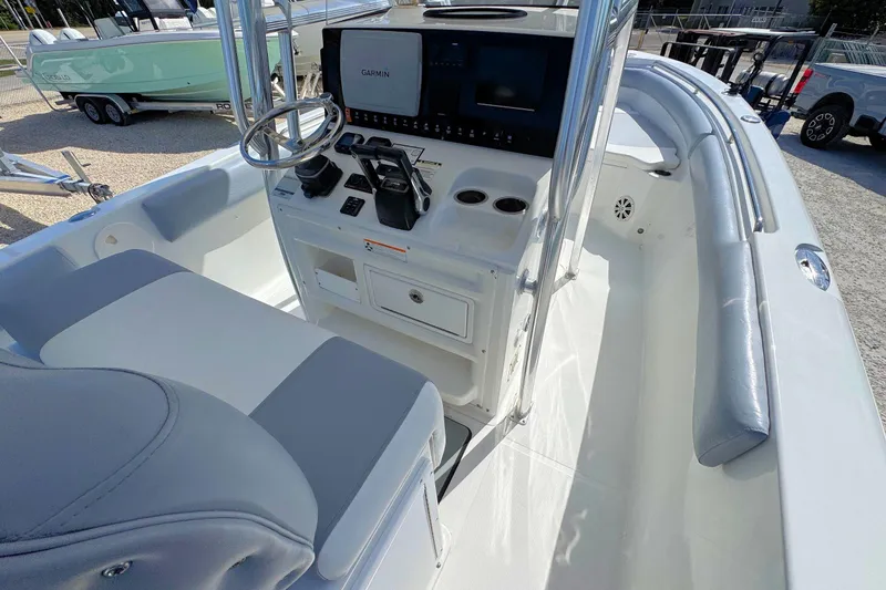 Slide: The Image of 2011 Sea Hunt Gamefish 25 boat interior with Garmin navigation system and seating. - 8