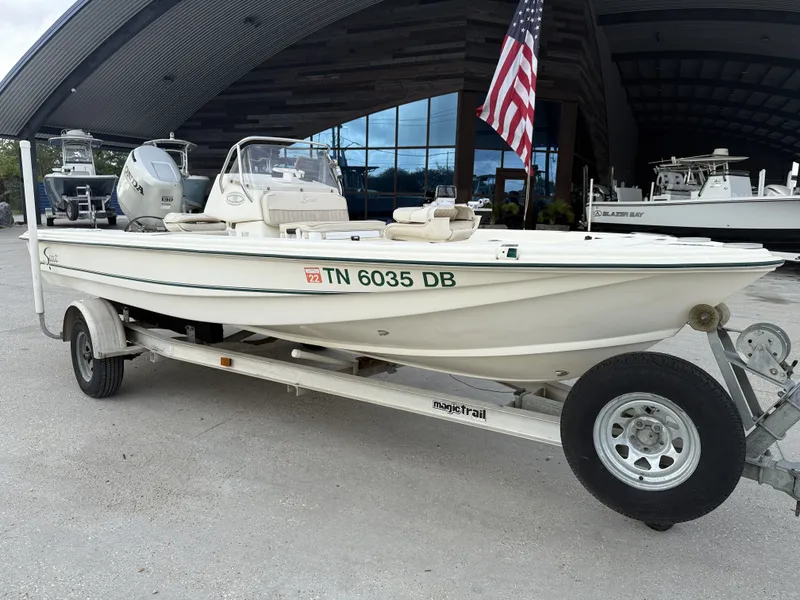 Slide: The Image of Scout 192 Sportfish 2000 on trailer with US flag. - 10