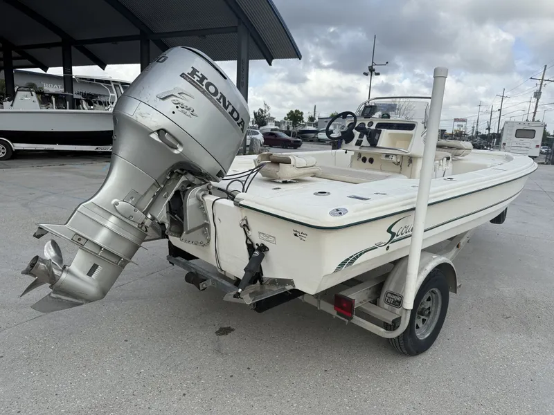 Slide: The Image of Scout 192 Sportfish 2000 with Honda outboard motor on trailer. - 4