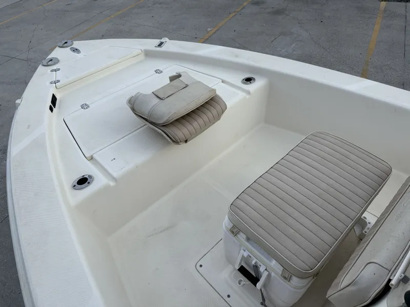Slide: The Image of Scout 192 Sportfish 2000 with cushioned seats and storage area. - 5