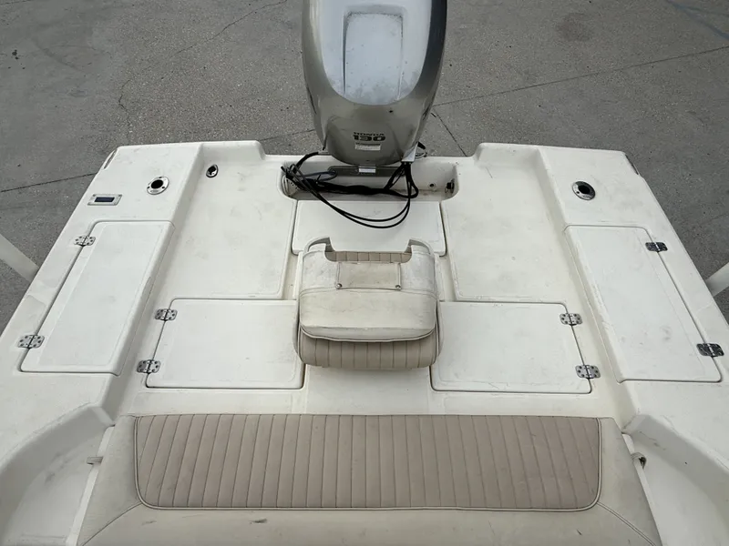Slide: The Image of Scout 192 Sportfish 2000 with outboard motor and seating area. - 9