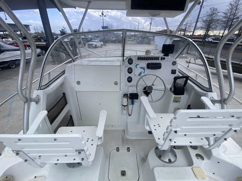 Slide: The Image of Interior view of a 2006 Polar 2300 WA boat with helm console. - 15