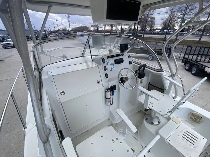 Slide: The Image of Interior view of a 2006 Polar 2300 WA boat with helm station. - 16