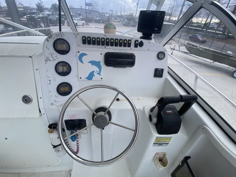 Slide: The Image of 2006 Polar 2300 WA boat helm with instruments and steering wheel. - 17