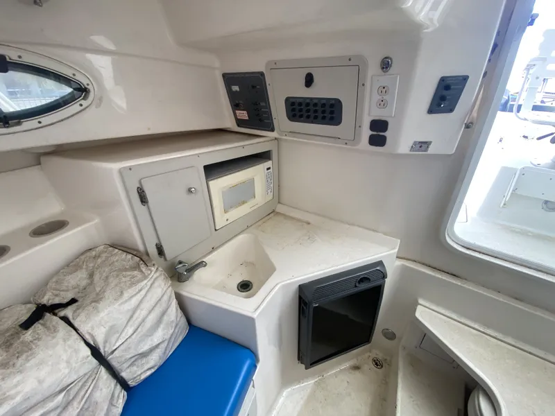 Slide: The Image of Interior of 2006 Polar 2300 WA with microwave and seating area. - 18