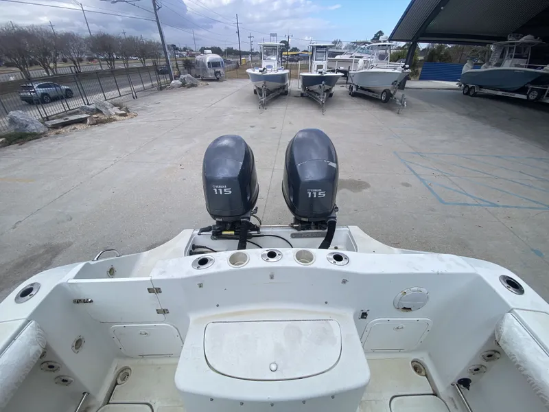 Slide: The Image of 2006 Polar 2300 WA boat with Yamaha 115 engines at dock. - 19