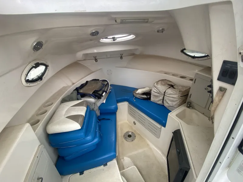 Slide: The Image of Interior of a 2006 Polar 2300 WA boat with blue cushions. - 6