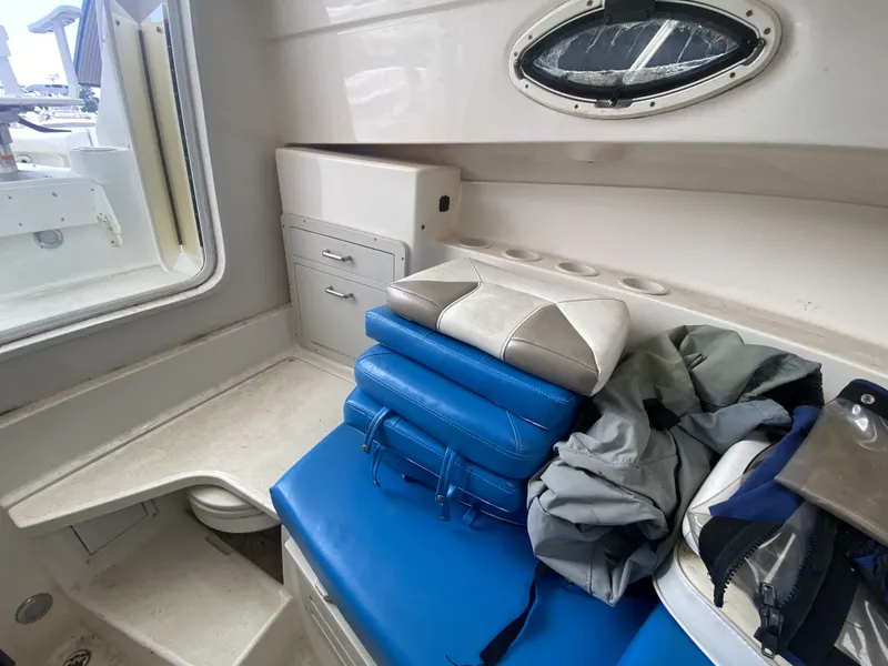 Slide: The Image of Interior of a 2006 Polar 2300 WA boat with blue cushions. - 7