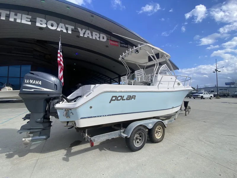Slide: The Image of 2006 Polar 2300 WA boat with Yamaha engine outdoors. - 9