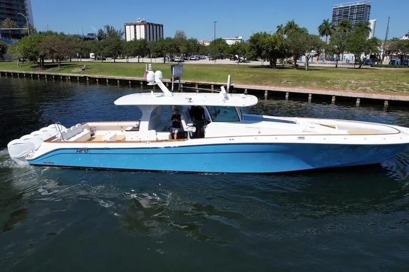 Slide: The Image of 2021 HCB 65 Estrella boat cruising on a calm waterway. - 100