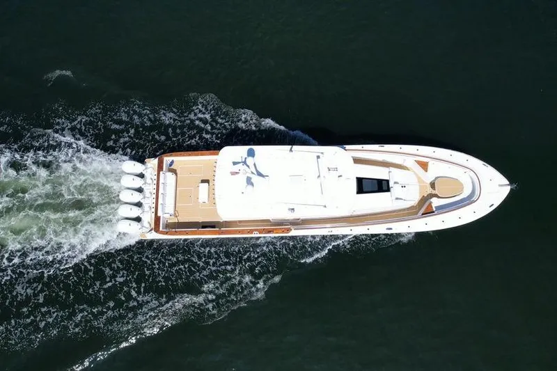 Slide: The Image of Aerial view of 2021 HCB 65 Estrella yacht cruising on water. - 101