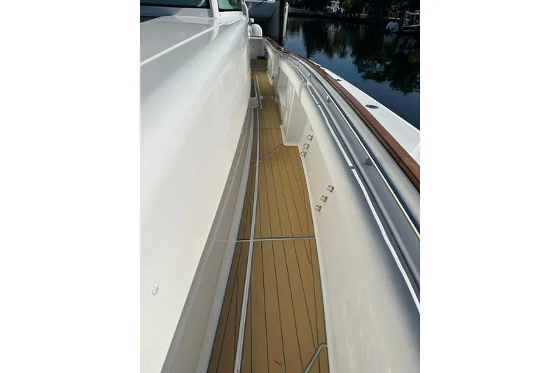 Slide: The Image of 2021 HCB 65 Estrella yacht deck with sleek design and polished wood finish. - 15