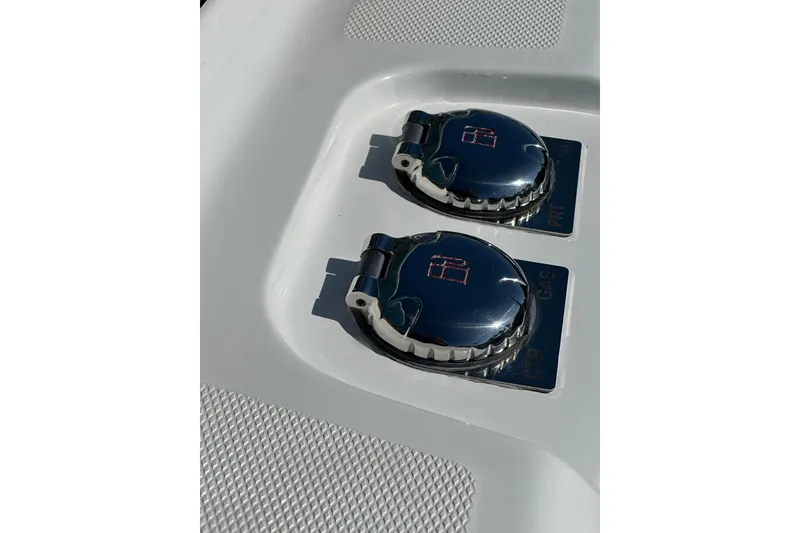 Slide: The Image of Fuel caps on a 2021 HCB 65 Estrella boat, featuring sleek chrome design. - 16