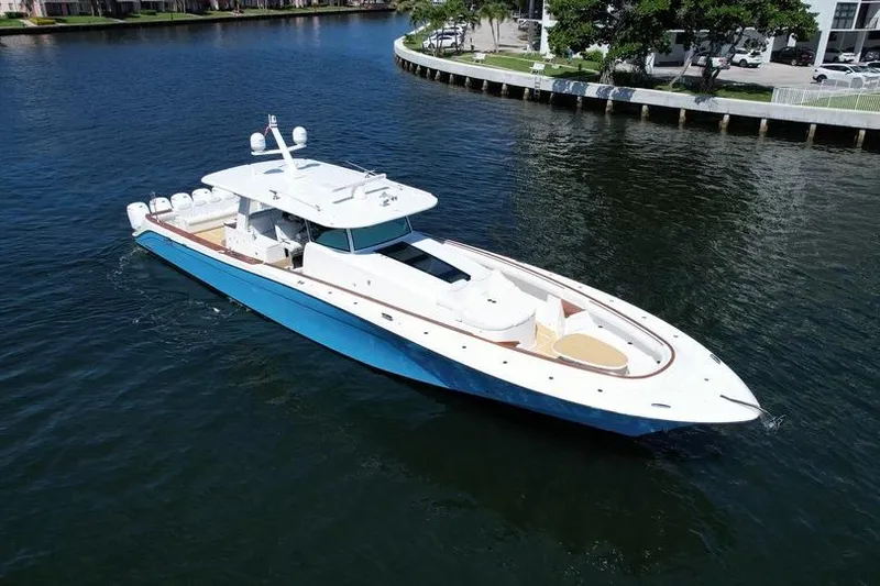 Slide: The Image of 2021 HCB 65 Estrella luxury yacht cruising on a calm waterway. - 2
