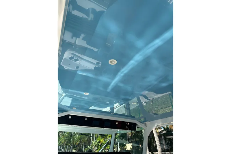 Slide: The Image of Interior view of 2021 HCB 65 Estrella boat with blue ceiling and recessed lighting. - 23