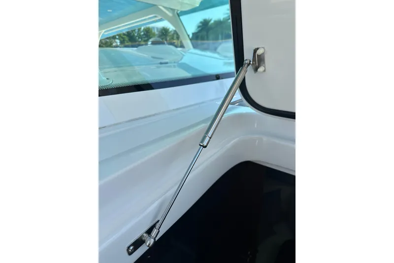Slide: The Image of Gas strut mechanism on 2021 HCB 65 Estrella boat, providing support and stability. - 29