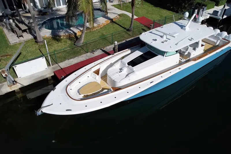 Slide: The Image of Aerial view of 2021 HCB 65 Estrella luxury yacht docked by a waterfront property. - 3