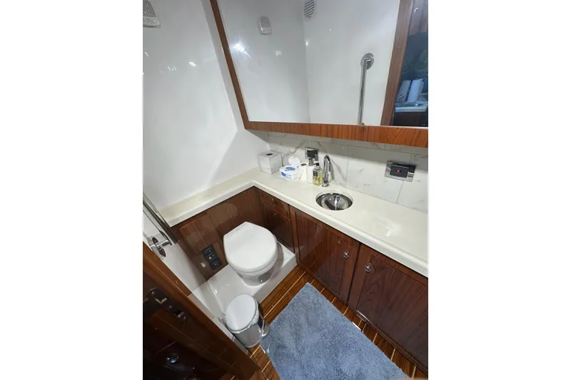 Slide: The Image of Luxurious bathroom in 2021 HCB 65 Estrella yacht with modern fixtures and wooden cabinetry. - 31